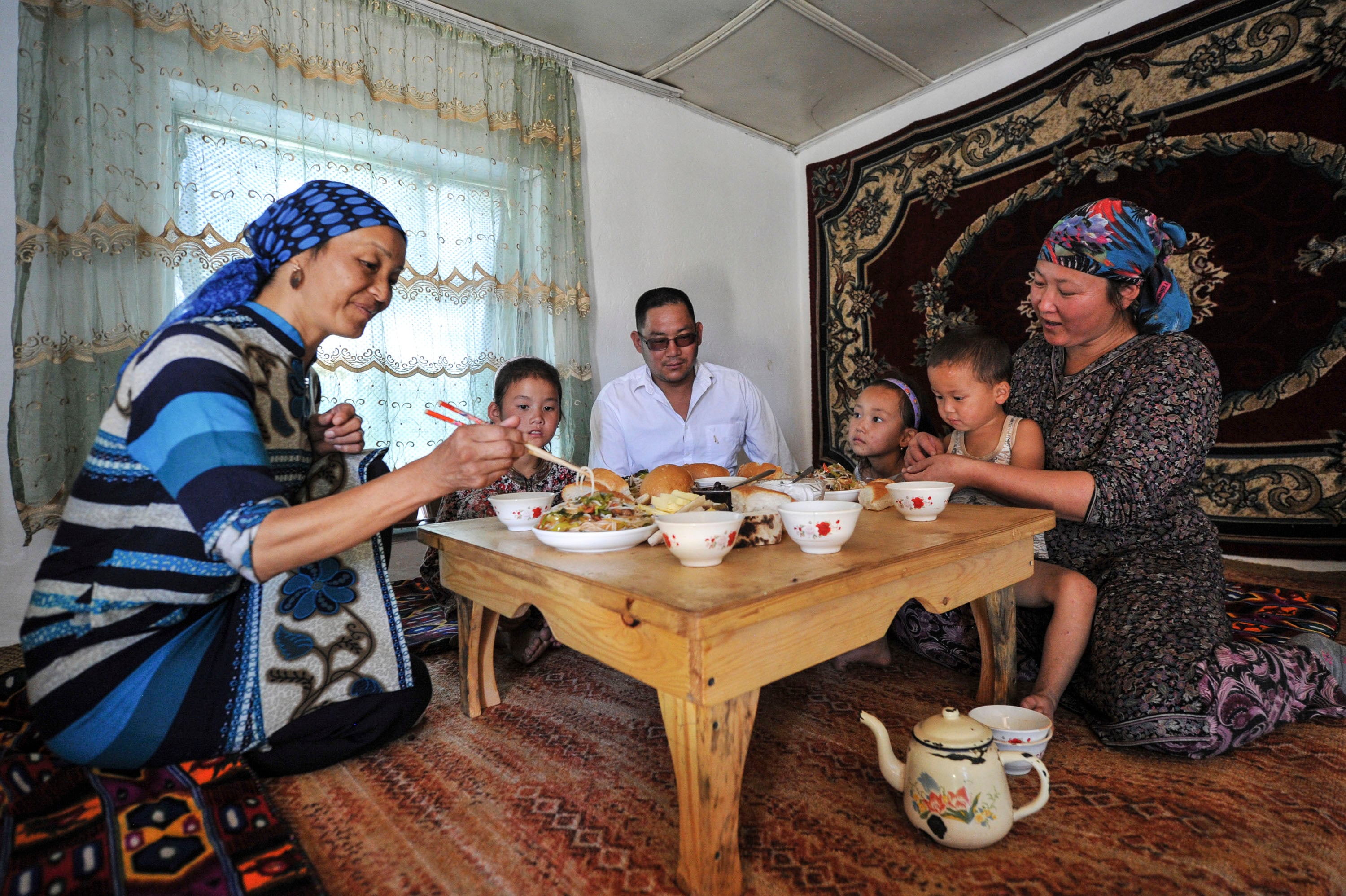 Family eating together image