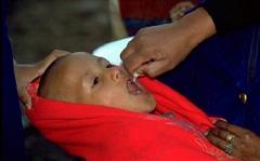 A child is protected from lifelong polio paralysis through OPV vaccination.